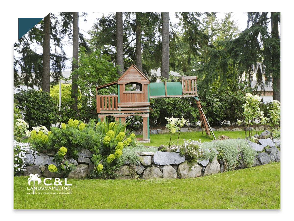 Rock wall with flowers surround play set